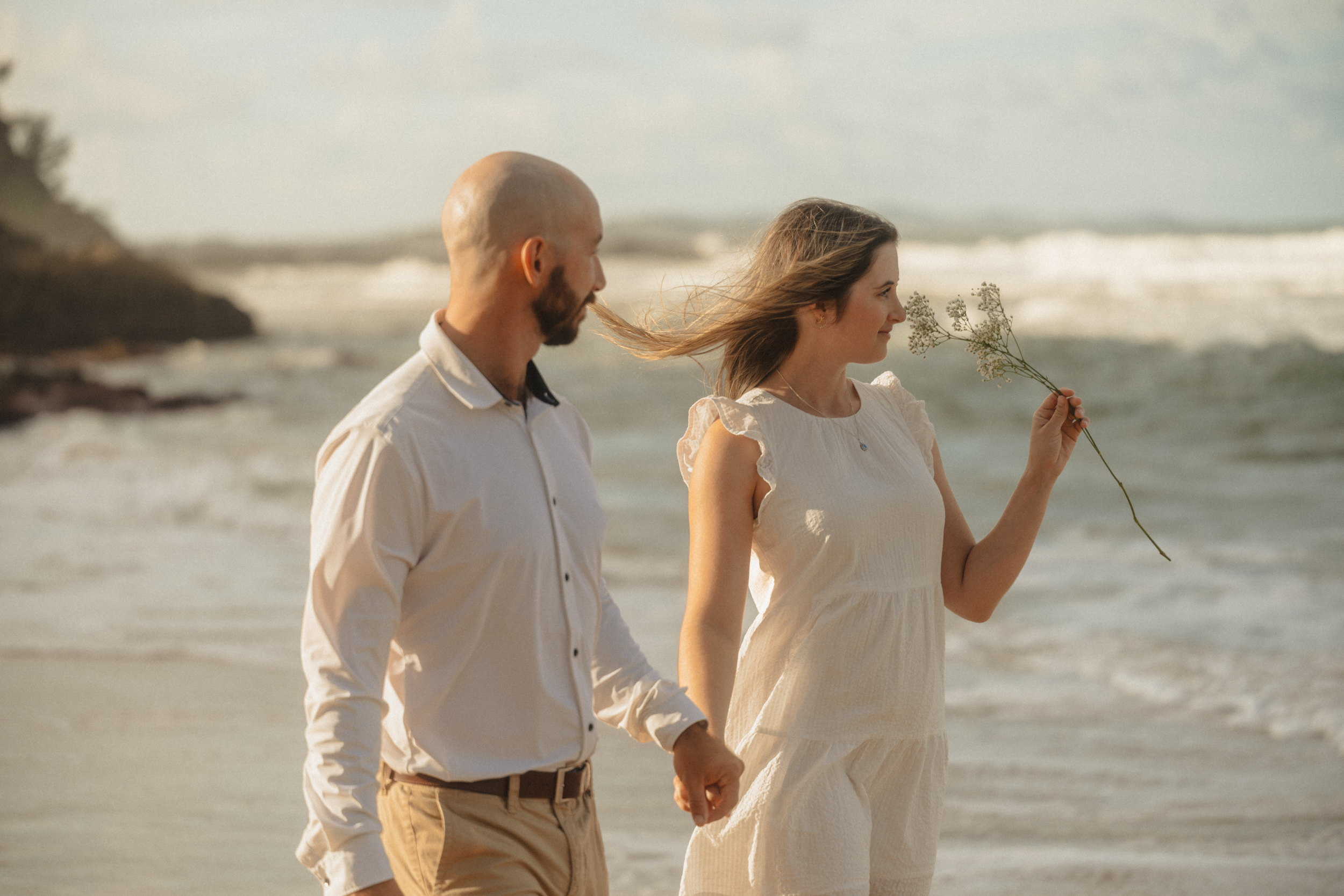 Couple at the beach, golden hour