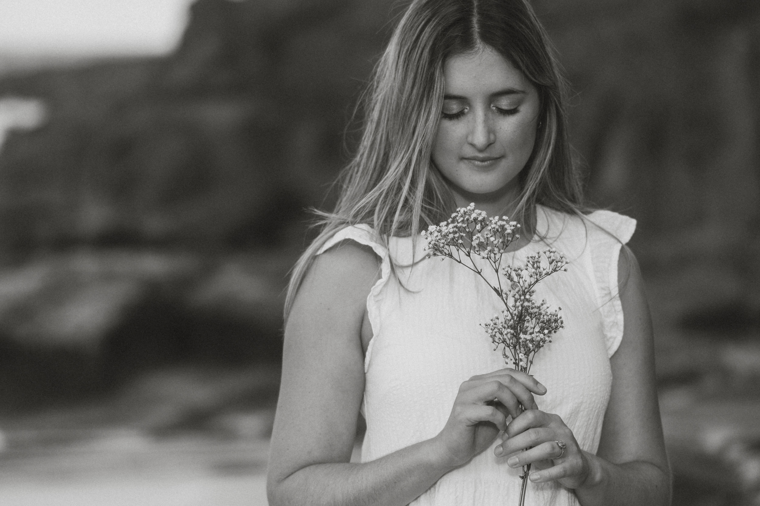 Black and white portrait with wildflowers