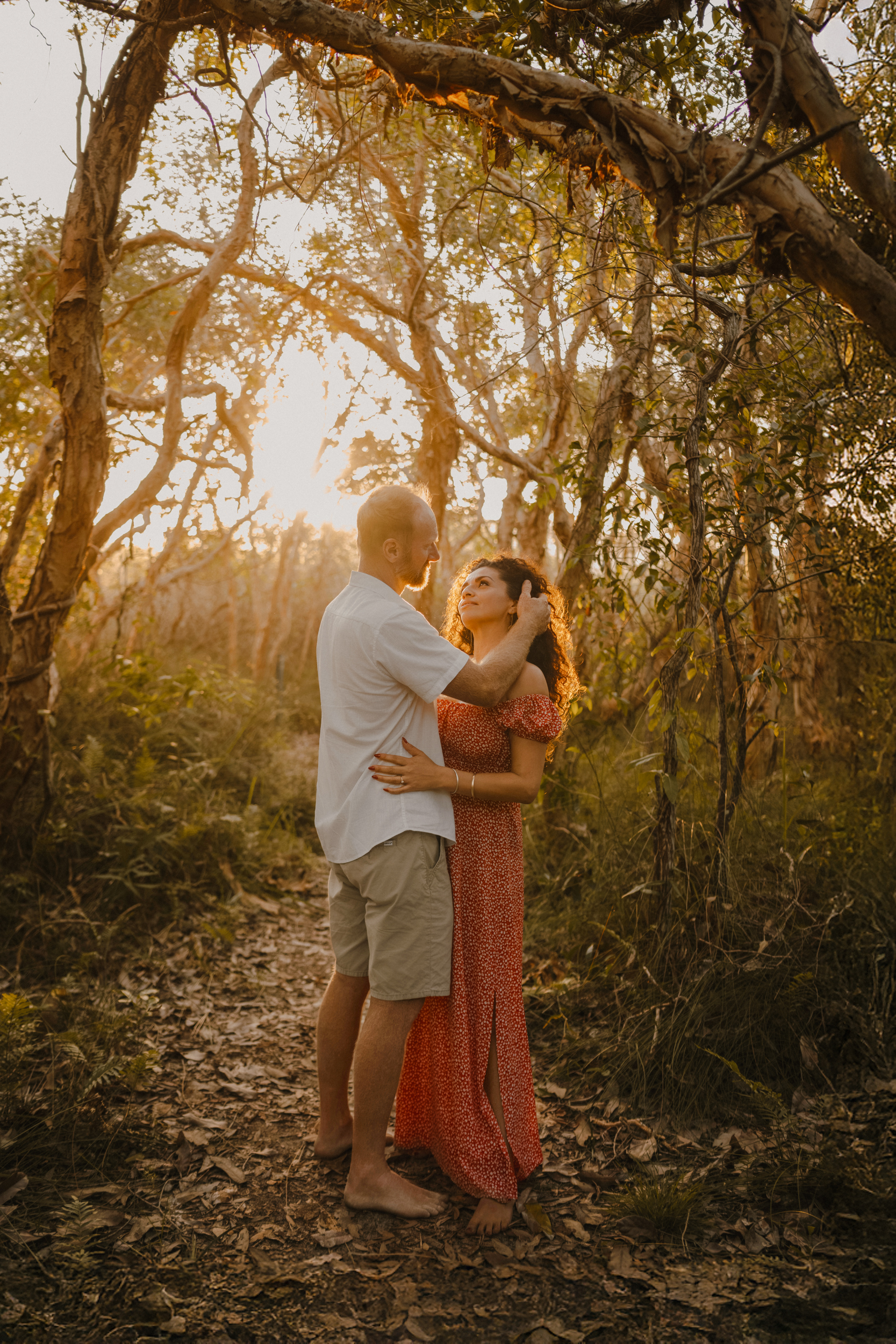 Couple in golden forest light