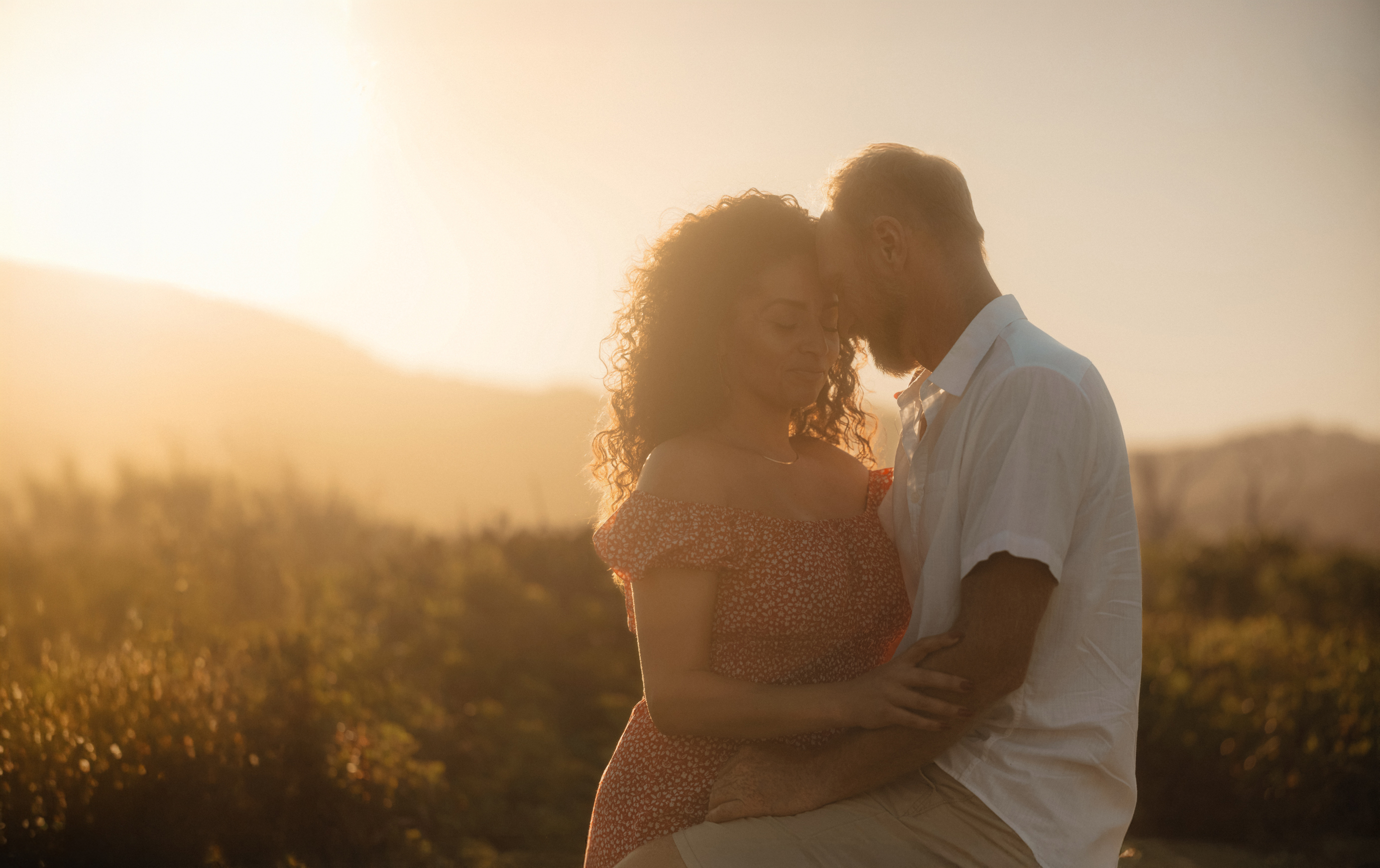 Couple kissing in golden hour light