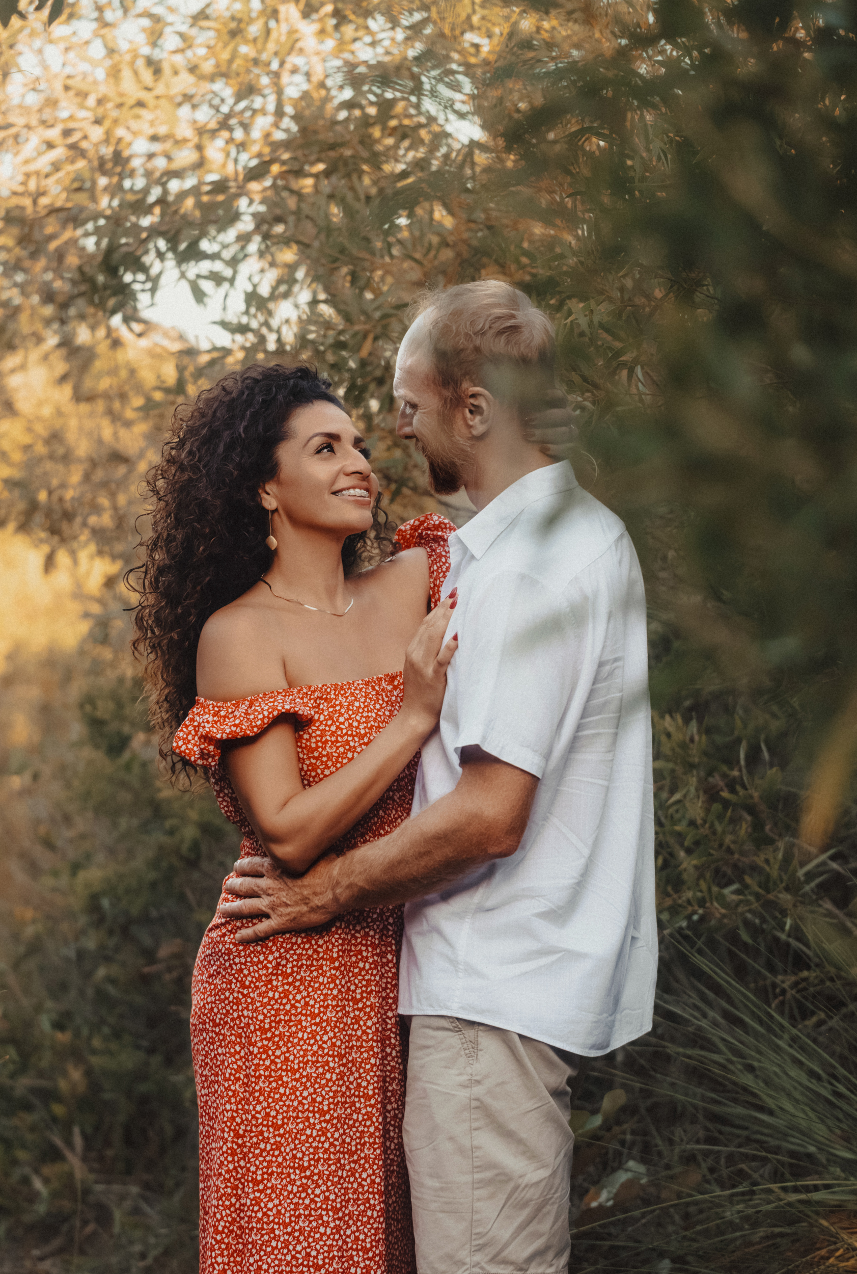 Couple embracing, warm orange tones